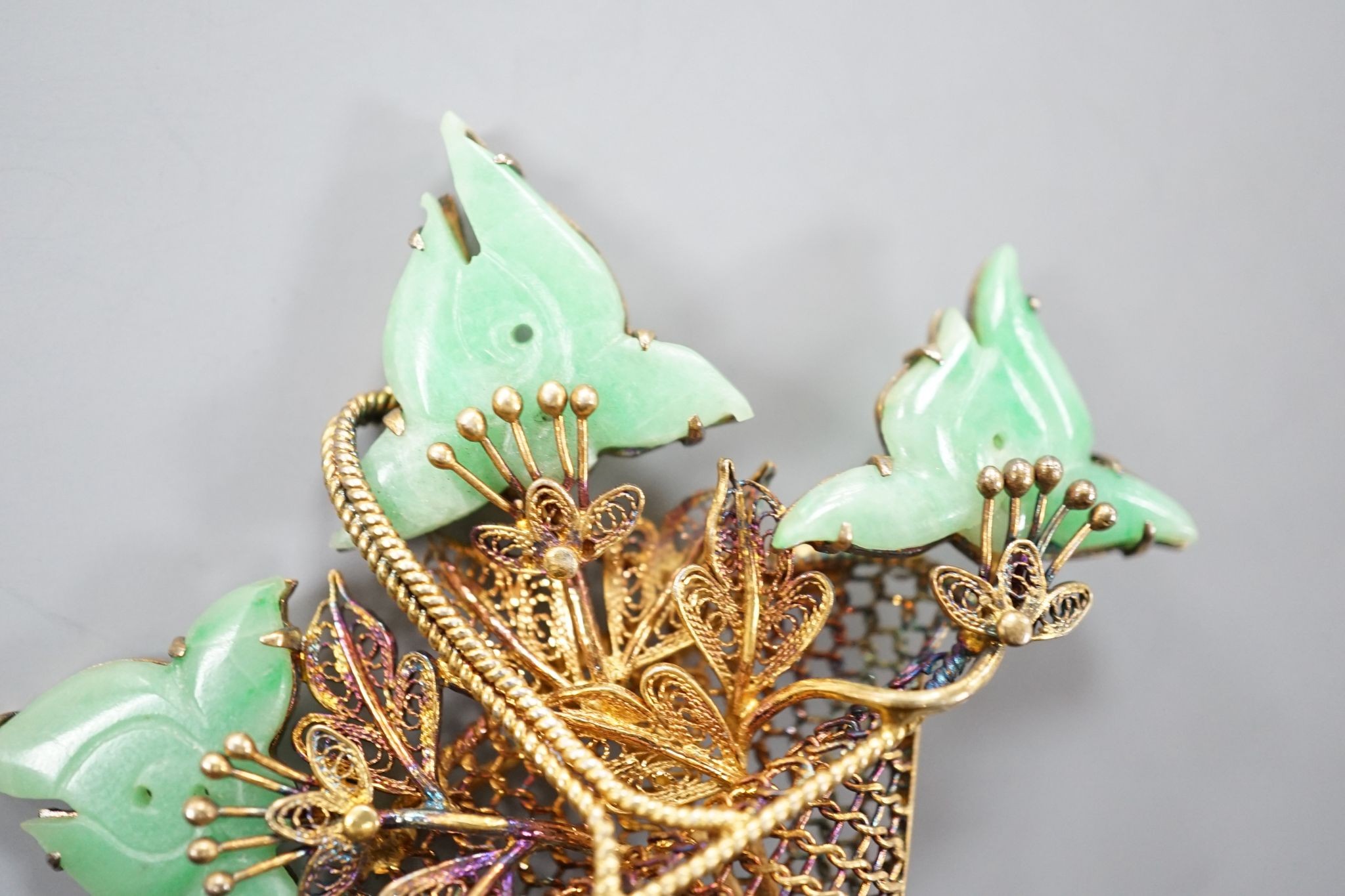 A continental gilt white metal and simulated jade set 'Basket of Flowers, brooch, height 49mm.